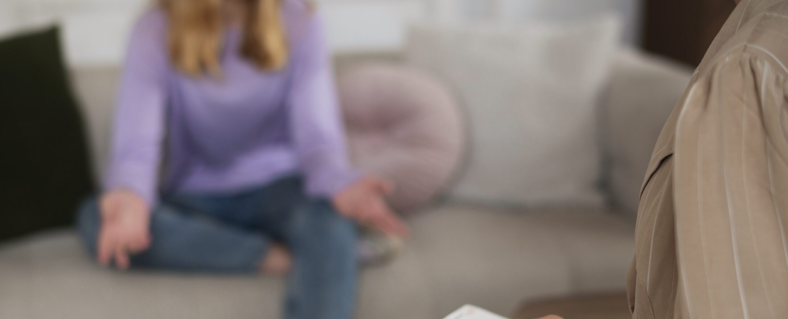 side-view-young-girl-talking-therapist-scaled-e1769458002274.jpg